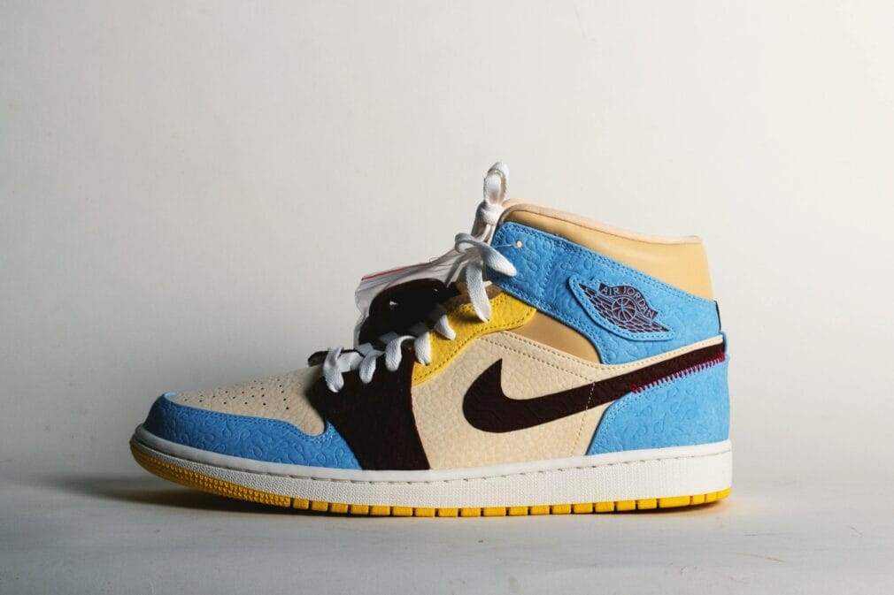 Vibrant Air Jordan sneaker with unique colorway on white background.